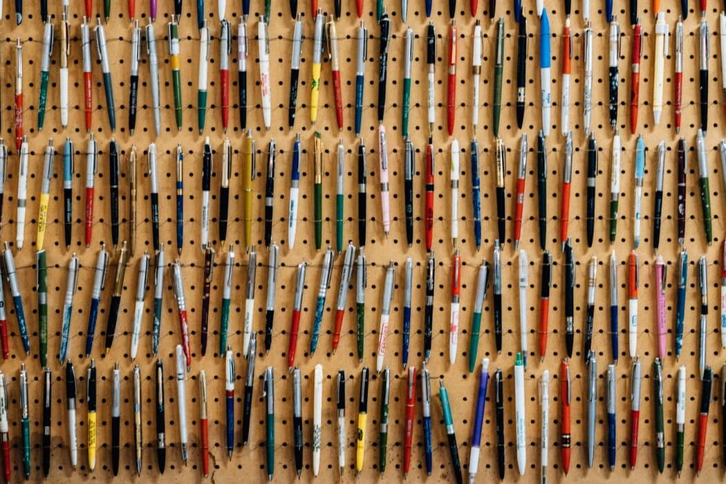 Photo of pens hung on a pegboard